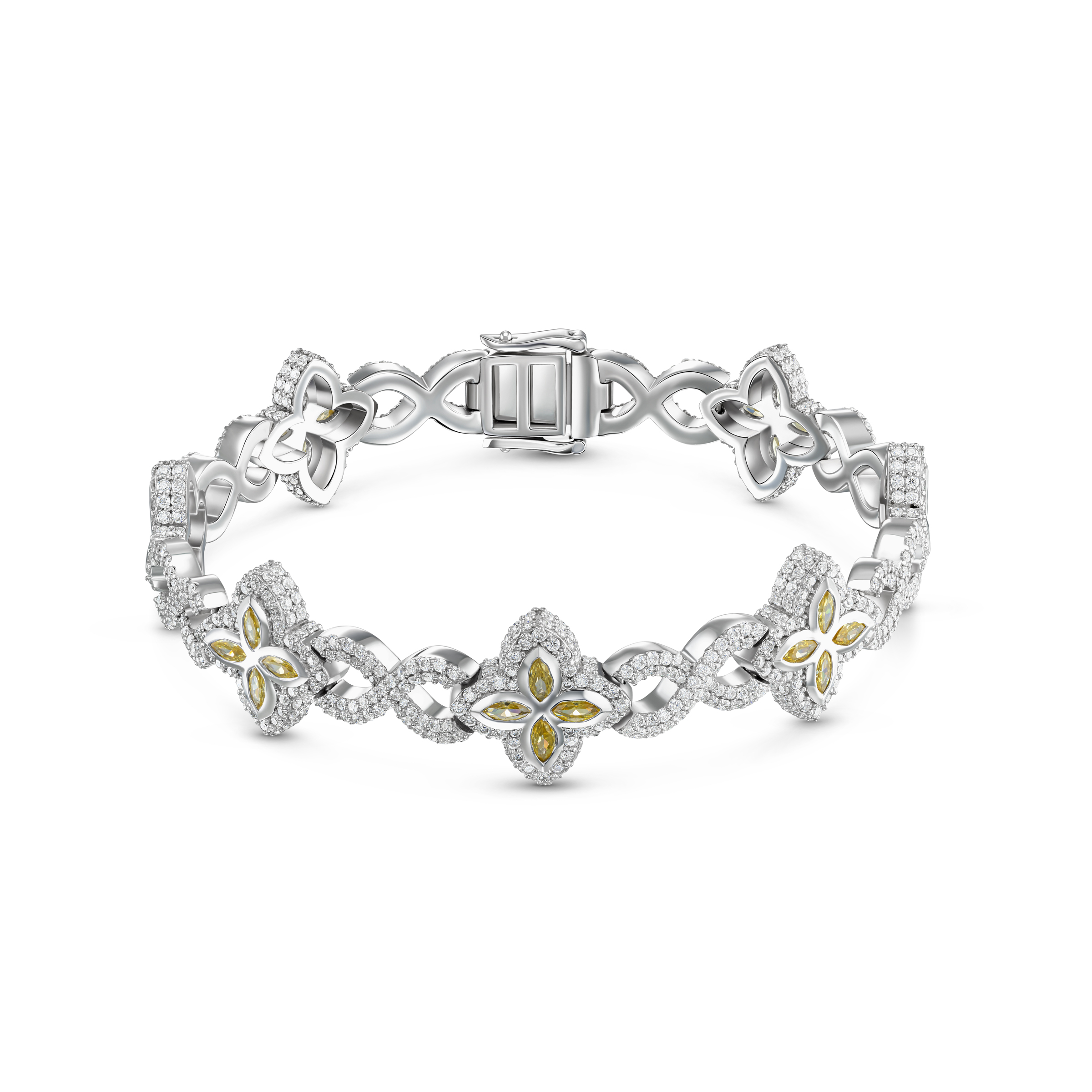 Luxe juwelenfotografie van witgouden armband met bloemvormige details en geel-witte edelstenen op witte achtergrond.